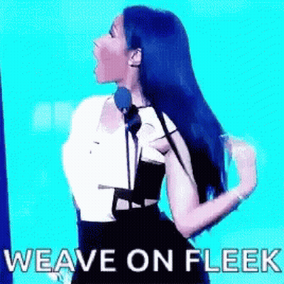 A Woman Is Standing In Front Of A Microphone With The Words `` Weave On Fleek '' Written On The Screen . GIF