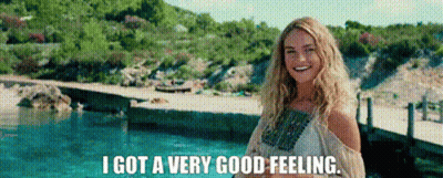 A Woman Is Standing In Front Of A Pool And Smiling . GIF