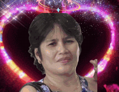 A Woman Is Standing In Front Of A Purple Heart GIF