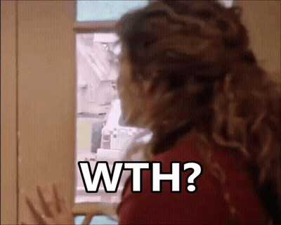 A Woman Is Standing In Front Of A Refrigerator Door And Asking Why ? GIF
