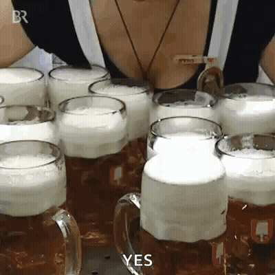 A Woman Is Standing In Front Of A Row Of Beer Mugs With The Words Yes Written On Them . GIF