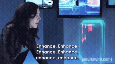A Woman Is Standing In Front Of A Screen That Says Enhance Enhance Enhance Enhance Enhance Enhance GIF