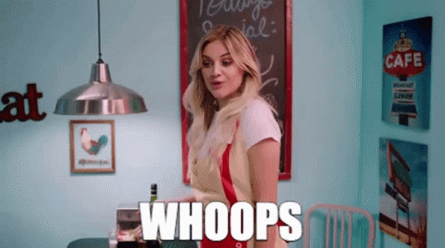 A Woman Is Standing In Front Of A Sign That Says Cafe On It GIF