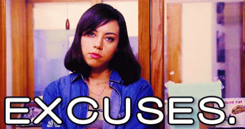 A Woman Is Standing In Front Of A Sign That Says Excuses GIF