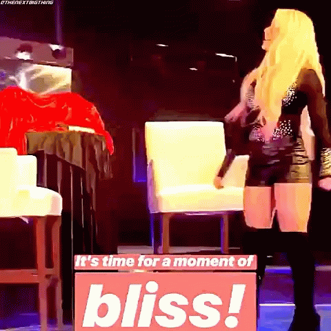 A Woman Is Standing In Front Of A Sign That Says It 'S Time For A Moment Of Bliss GIF