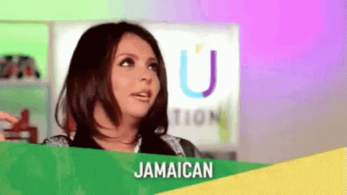 A Woman Is Standing In Front Of A Sign That Says Jamaican And Looking At The Camera . GIF