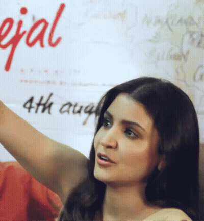 A Woman Is Standing In Front Of A Sign That Says Special 4Th August GIF