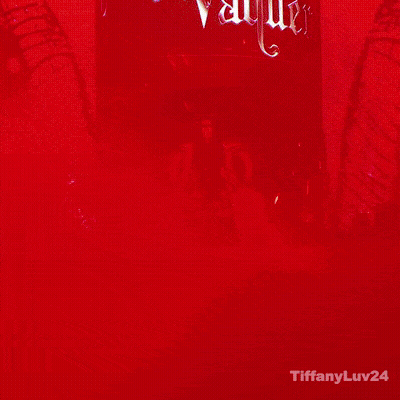 A Woman Is Standing In Front Of A Sign That Says Stephanie Varquez GIF