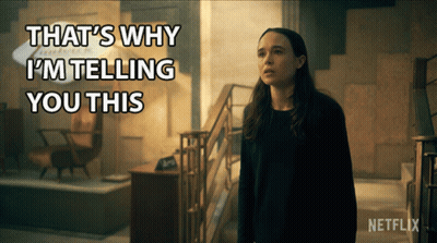 A Woman Is Standing In Front Of A Sign That Says That 'S Why I 'M Telling You This On It GIF