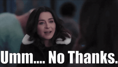 A Woman Is Standing In Front Of A Sign That Says ' Umm ... No Thanks ' . GIF