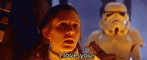 A Woman Is Standing In Front Of A Stormtrooper And Saying `` I Love You '' . GIF