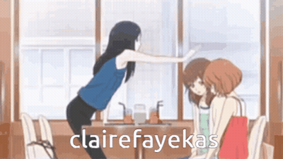 A Woman Is Standing In Front Of A Table With Two Other Women Sitting At It . GIF