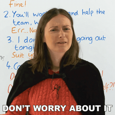 A Woman Is Standing In Front Of A White Board And Says " Don T Worry About It " GIF