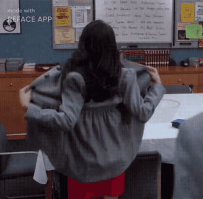 A Woman Is Standing In Front Of A White Board That Says ' Reface App ' On It GIF