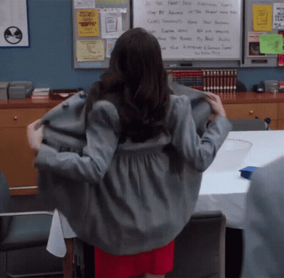 A Woman Is Standing In Front Of A Whiteboard That Says " All The First Dick " GIF