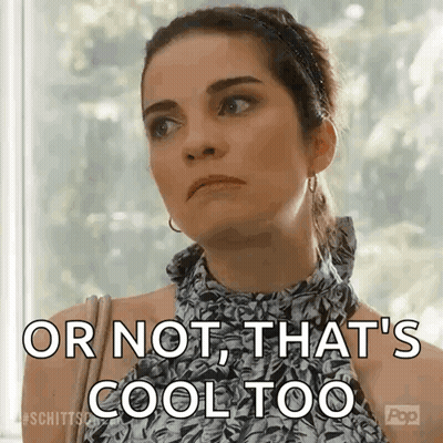 A Woman Is Standing In Front Of A Window And Saying `` Or Not That 'S Cool Too '' . GIF