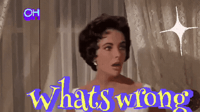 A Woman Is Standing In Front Of A Window With The Words " What 'S Wrong " On The Screen GIF