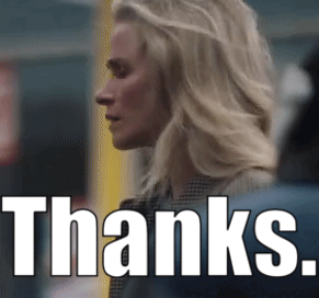 A Woman Is Standing In Front Of The Words Thanks GIF