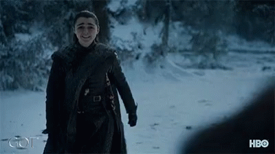 A Woman Is Standing In The Snow With Hbo Written On The Bottom GIF