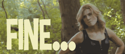 A Woman Is Standing In The Woods And The Word Fine Is Visible Behind Her GIF