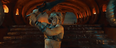 A Woman Is Standing Next To A Man In A Dark Room With A Sword . GIF