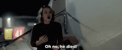 A Woman Is Standing On The Stairs Of An Airplane With Her Mouth Open And Says Oh No , He Died . GIF
