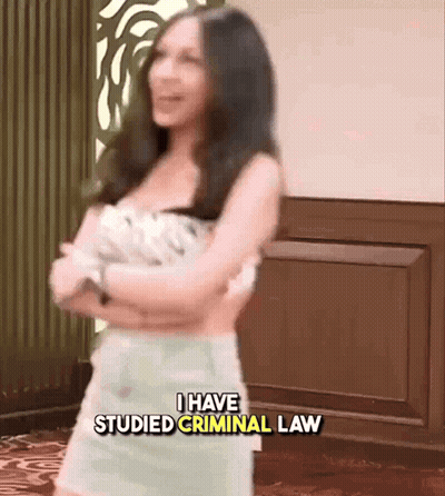 A Woman Is Standing With Her Arms Crossed And The Words I Have Studied Criminal Law Above Her GIF
