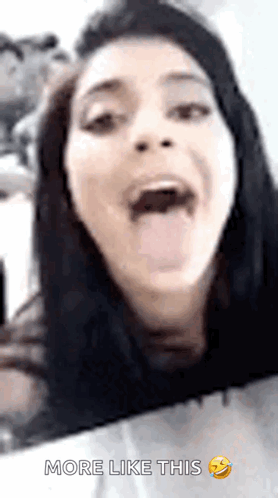 A Woman Is Sticking Her Tongue Out And Making A Funny Face With The Words More Like This Below Her GIF