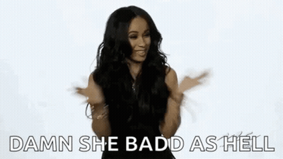 A Woman Is Sticking Her Tongue Out While Dancing And Making A Funny Face . GIF