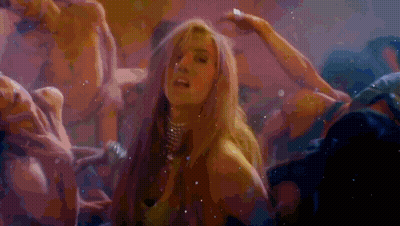 A Woman Is Surrounded By A Group Of Men In A Dark Room GIF