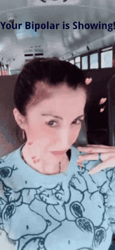 A Woman Is Taking A Picture Of Herself On A Bus With The Words " Your Bipolar Is Showing " On The Bottom GIF