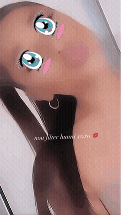 A Woman Is Taking A Selfie With A Cartoon Face On Her Face And The Caption Says Non Filter Hunni Xoxo GIF