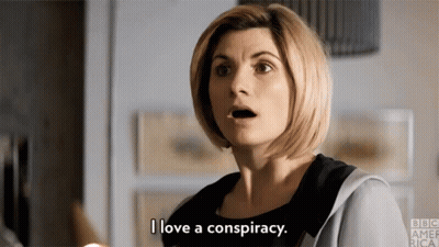 A Woman Is Talking About A Conspiracy And Making A Surprised Face . GIF