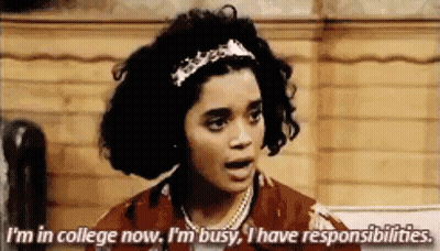 A Woman Is Talking About Her Responsibilities While Standing In Front Of A Wooden Wall . GIF
