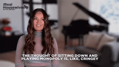 A Woman Is Talking About Playing Monopoly And Sitting Down GIF