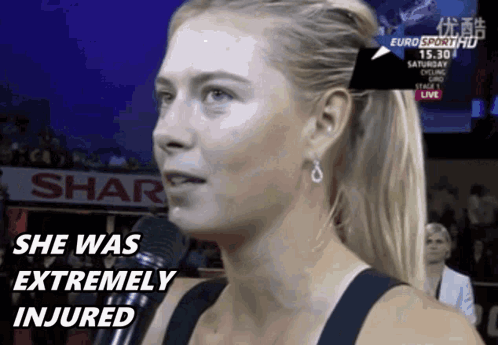 A Woman Is Talking Into A Microphone And The Words She Was Extremely Injured Are On The Screen GIF