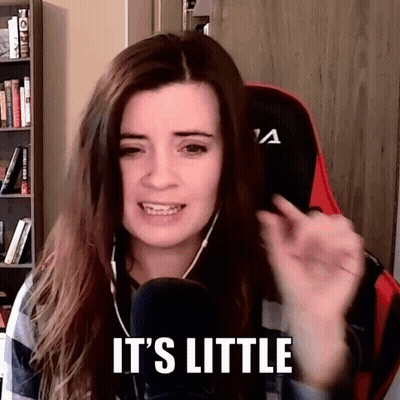A Woman Is Talking Into A Microphone While Wearing Headphones And Saying `` It 'S Little '' . GIF