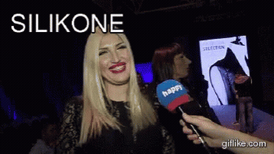 A Woman Is Talking Into A Microphone With The Word Silikone Above Her GIF