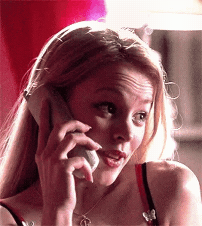 A Woman Is Talking On A Cell Phone And Making A Funny Face GIF