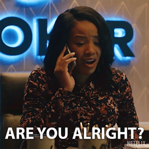 A Woman Is Talking On A Cell Phone And Saying Are You Alright . GIF