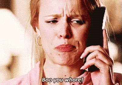 A Woman Is Talking On A Cell Phone And Says Boo You Whore ! GIF