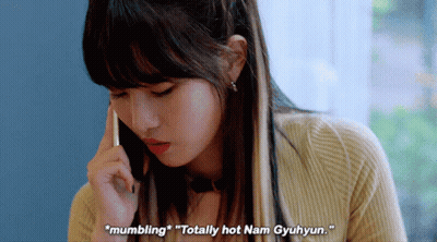 A Woman Is Talking On A Cell Phone And Says " Mumbling " GIF