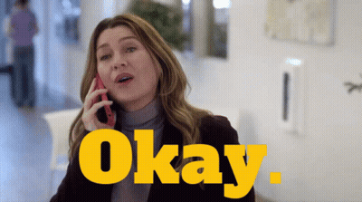 A Woman Is Talking On A Cell Phone And The Word Okay Is Behind Her GIF