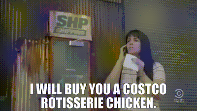 A Woman Is Talking On A Cell Phone In Front Of A Costco Rotisserie Chicken Sign GIF