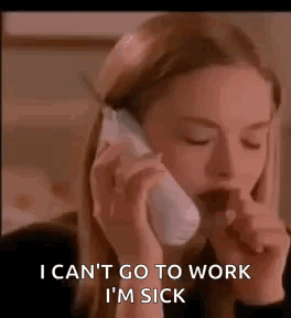 A Woman Is Talking On A Cell Phone While Coughing . GIF