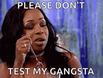 A Woman Is Talking On A Cell Phone With A Caption That Says `` Please Don T Test My Gangsta '' . GIF