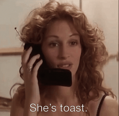 A Woman Is Talking On A Cell Phone With The Words She 'S Toast Written Below Her GIF