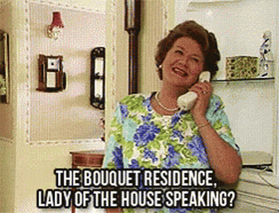 A Woman Is Talking On A Phone With The Words " The Bouquet Residence Lady Of The House Speaking " Above Her GIF