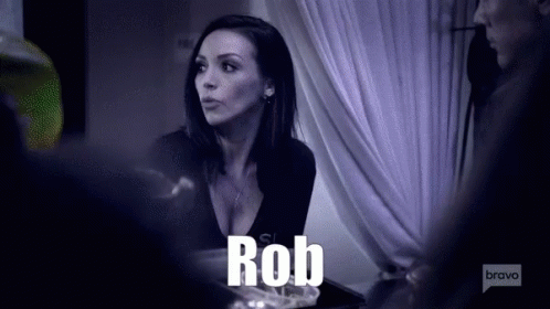 A Woman Is Talking To A Man And The Word Rob Is Visible GIF