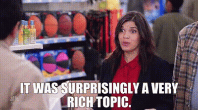 A Woman Is Talking To A Man In A Store And The Words `` It Was Surprisingly A Very Rich Topic '' Are Visible . GIF